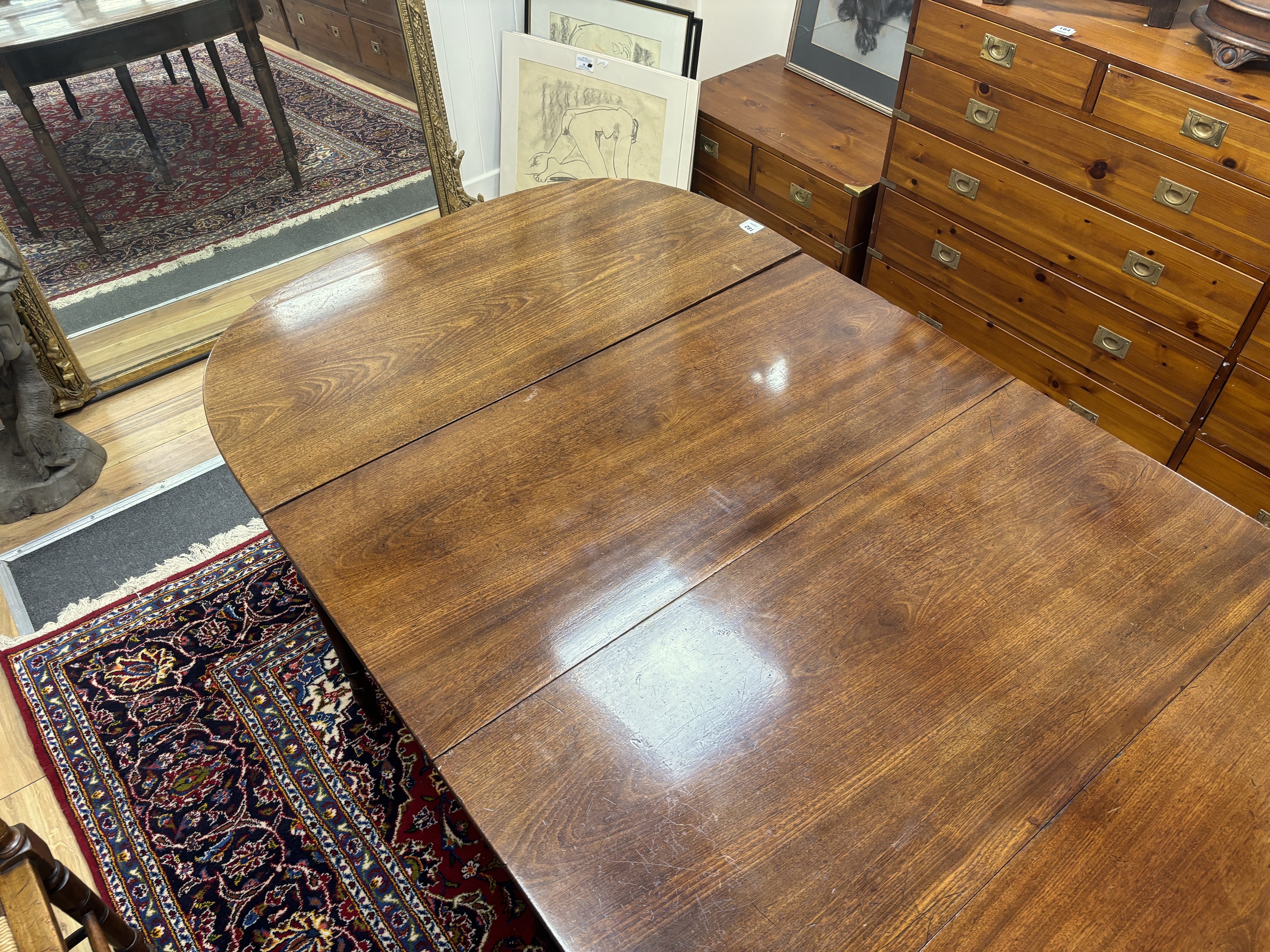 A Regency mahogany D end extending dining table, 257cm extended, width 109cm, height 70cm